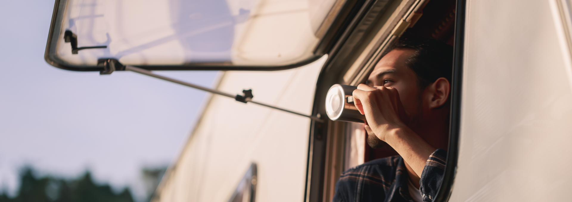 man looking out tourer window
