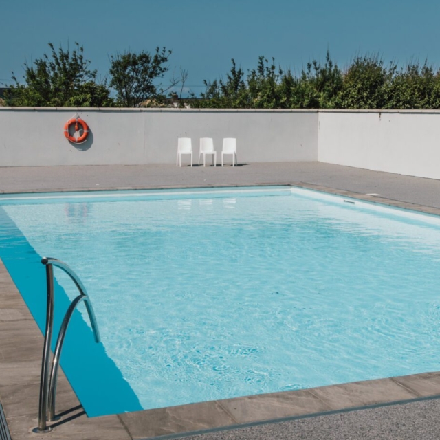 Heated outdoor swimming pool and modern gym