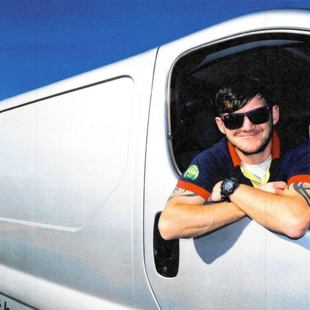 Thornley Leisure Parks maintenance team member leaning from a work van window.