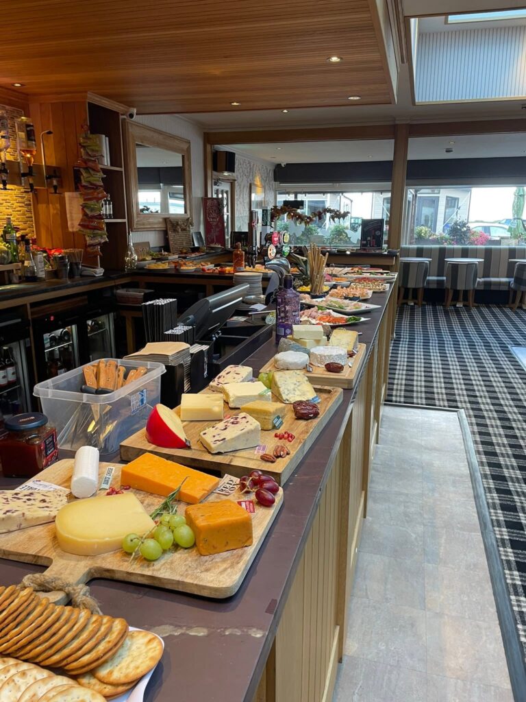 Cheese, crackers and accompaniments arranged for a tasting event