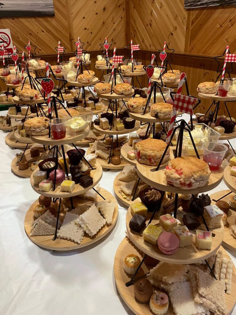 Tiered stands filled with sandwiches and cakes for afternoon tea