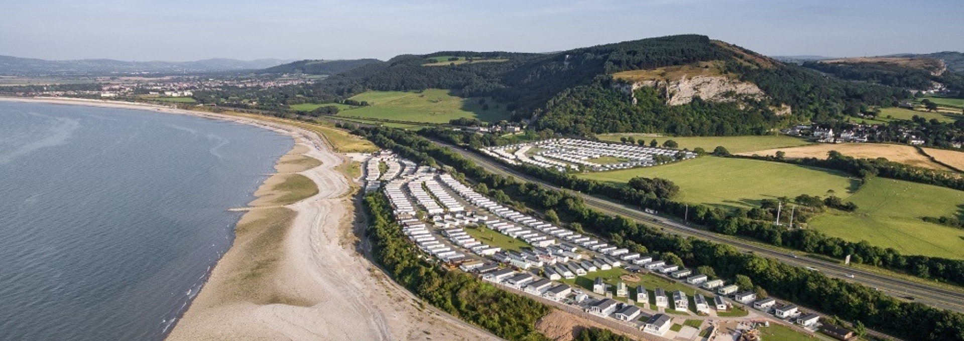 Aerial view of The Beach Caravan Park beside the North Wales coast