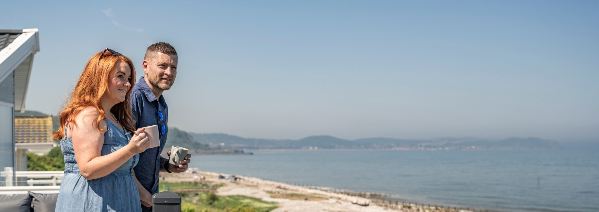 Couple enjoying coastal views from The Beach Caravan Park