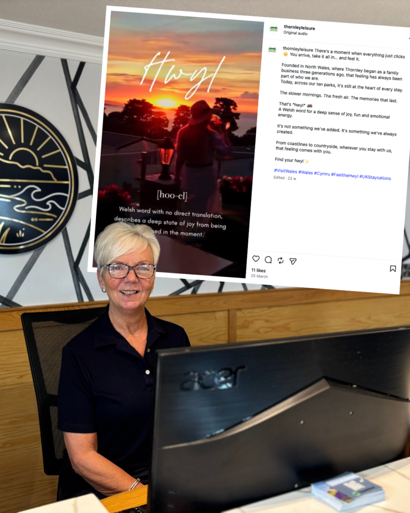 Reception team member with Welsh-language visitor content